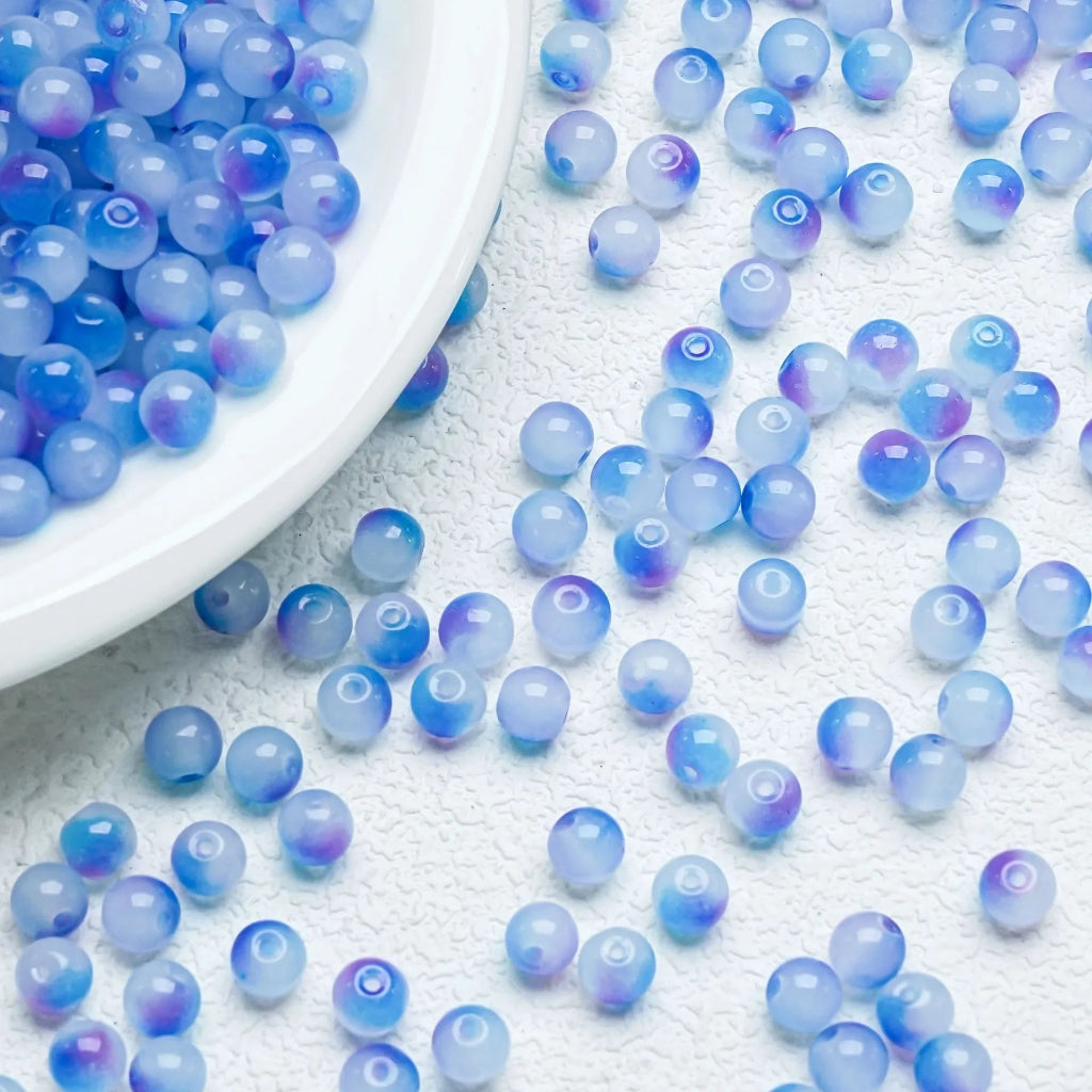 Blue‑Purple gradient glossy beads with a polished shine. Vibrant and perfect for elegant handmade jewellery.