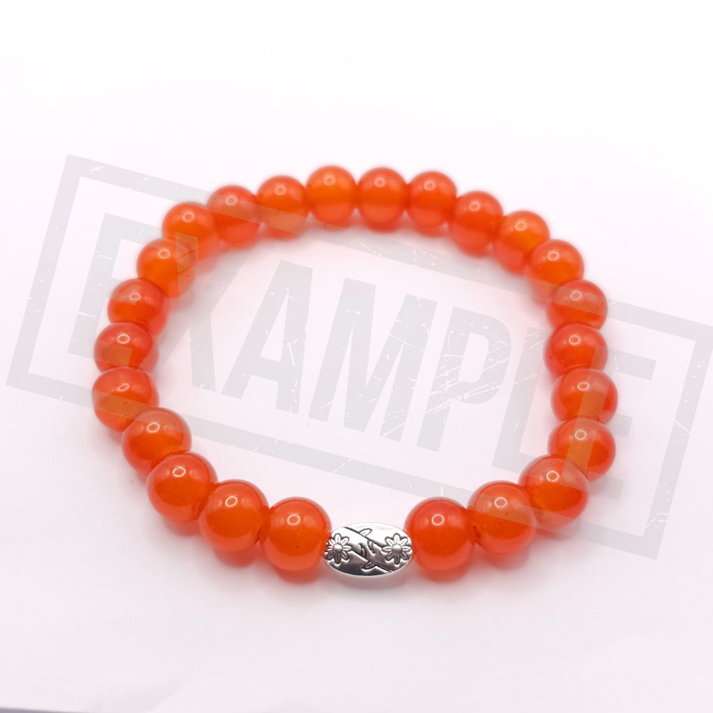A beaded stretch bracelet made of glossy dark orange glass beads with a textured silver metal accent bead, shown on a white background.