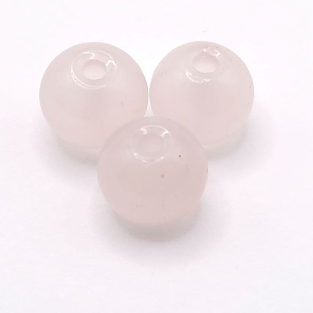 Three fruit powder pink translucent round beads with drilled centers, arranged on a white background.