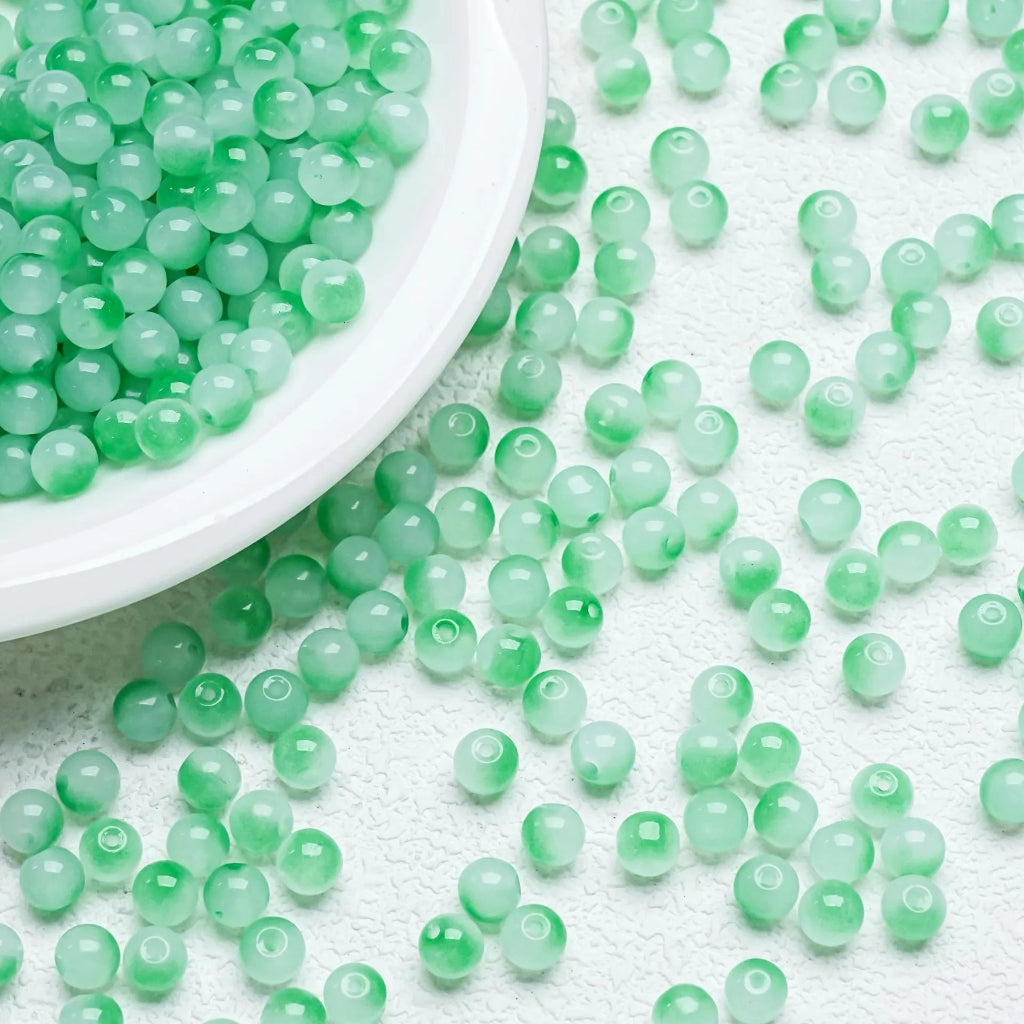 Green‑Blue gradient glossy beads with a soft shine. Fresh and perfect for ocean‑inspired jewellery.