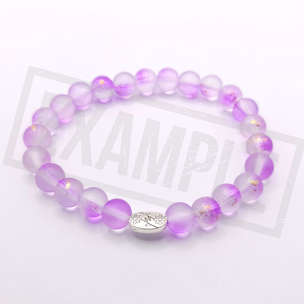 A medium purple translucent beaded bracelet with a silver oval charm, displayed on a white background.