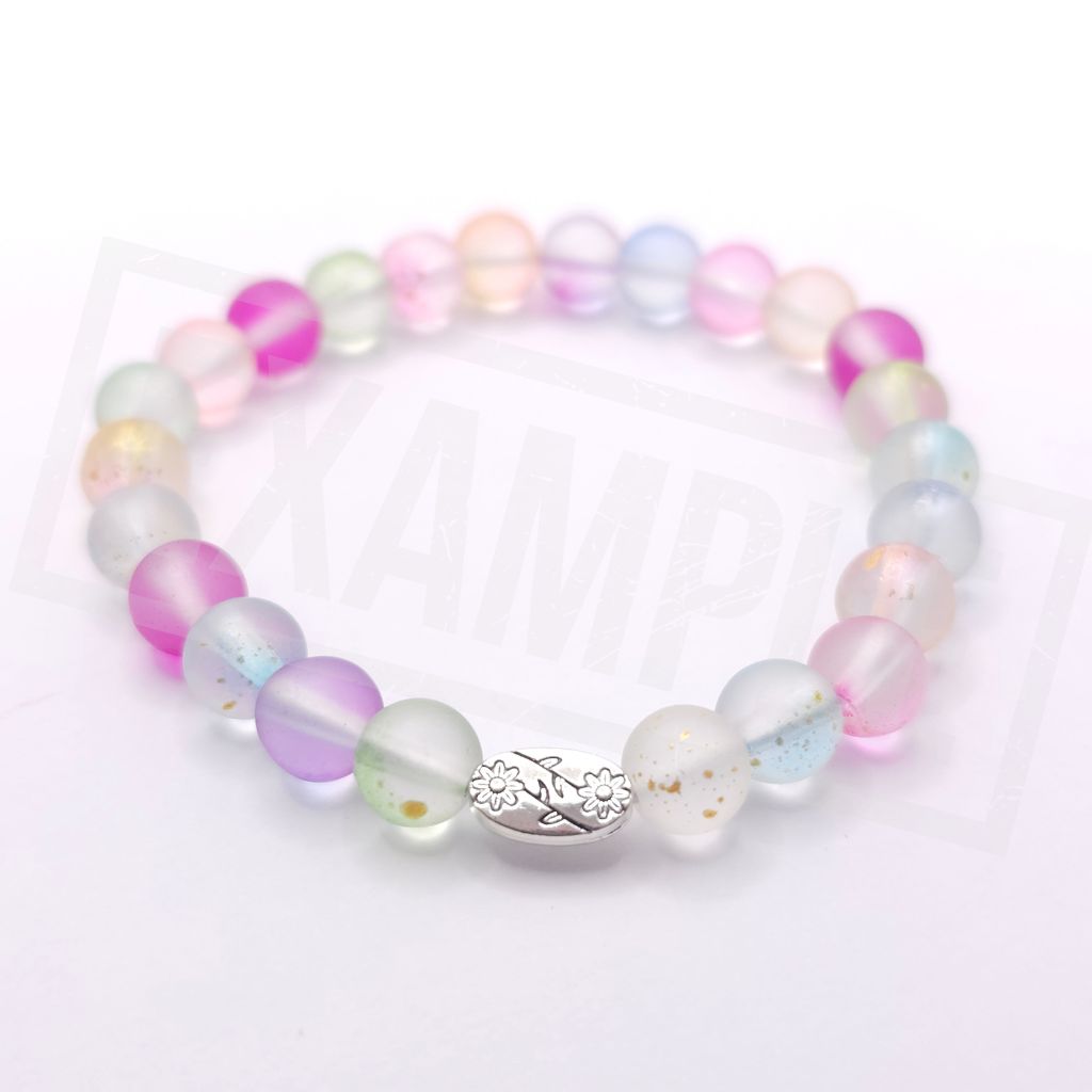 A pastel beaded stretch bracelet featuring translucent round beads in pink, purple, blue, green, and white, with a silver-toned floral charm in the center, shown on a white background.