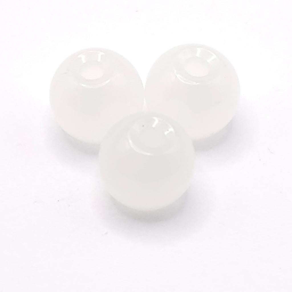 Three small round translucent moonstone white beads arranged in a triangle on a plain white background.