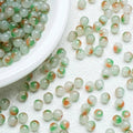 Orange‑Green gradient glossy beads with a bright shine. Bold and perfect for creative handmade jewellery.