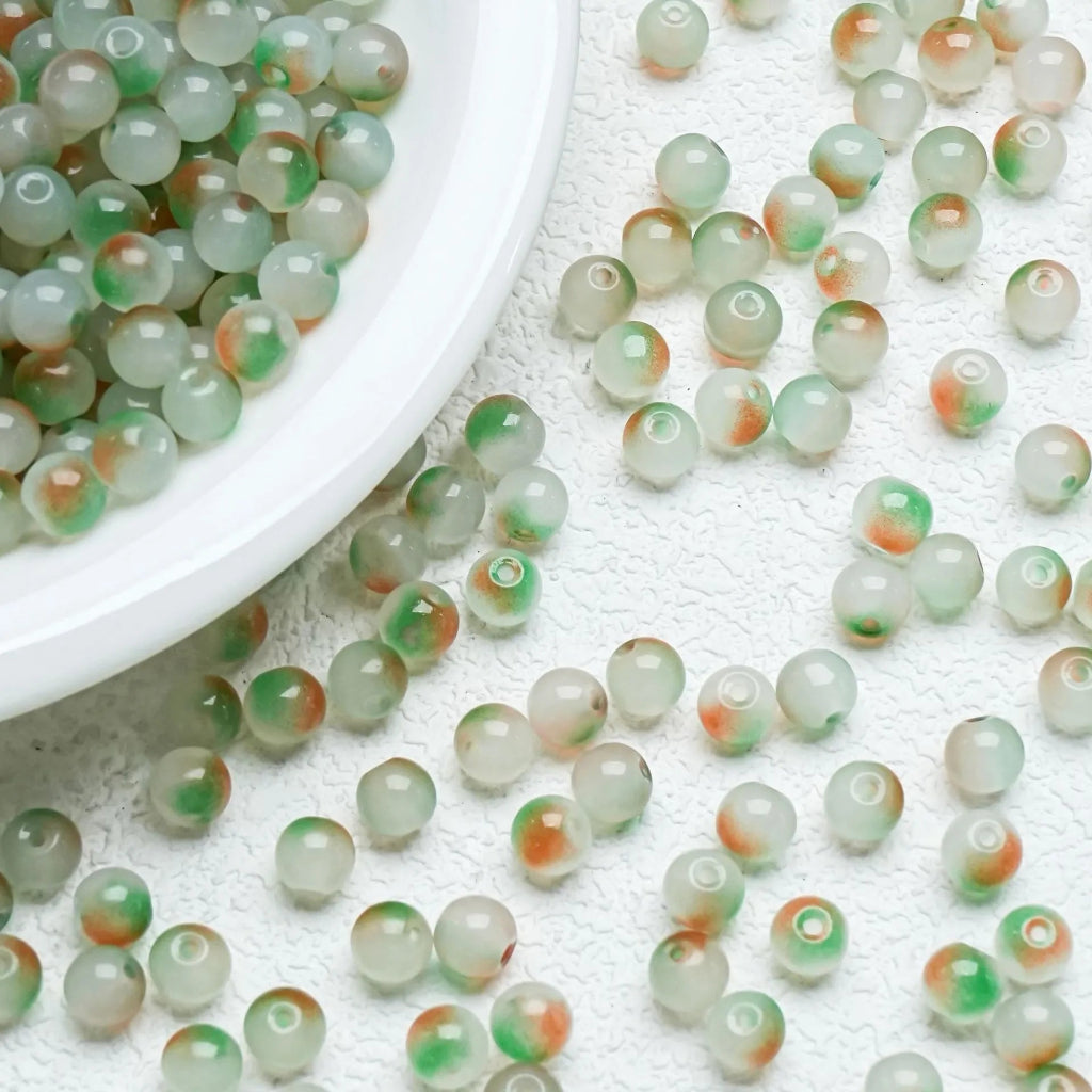 Orange‑Green gradient glossy beads with a bright shine. Bold and perfect for creative handmade jewellery.