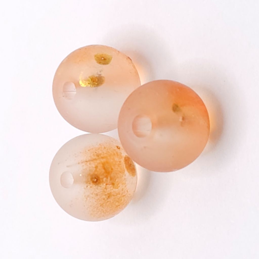 Orange frosted glass beads with a matte finish. Bright, warm and perfect for vibrant handmade jewellery.