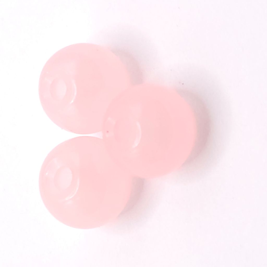 Three round, peach translucent beads arranged in a triangle on a plain white background.