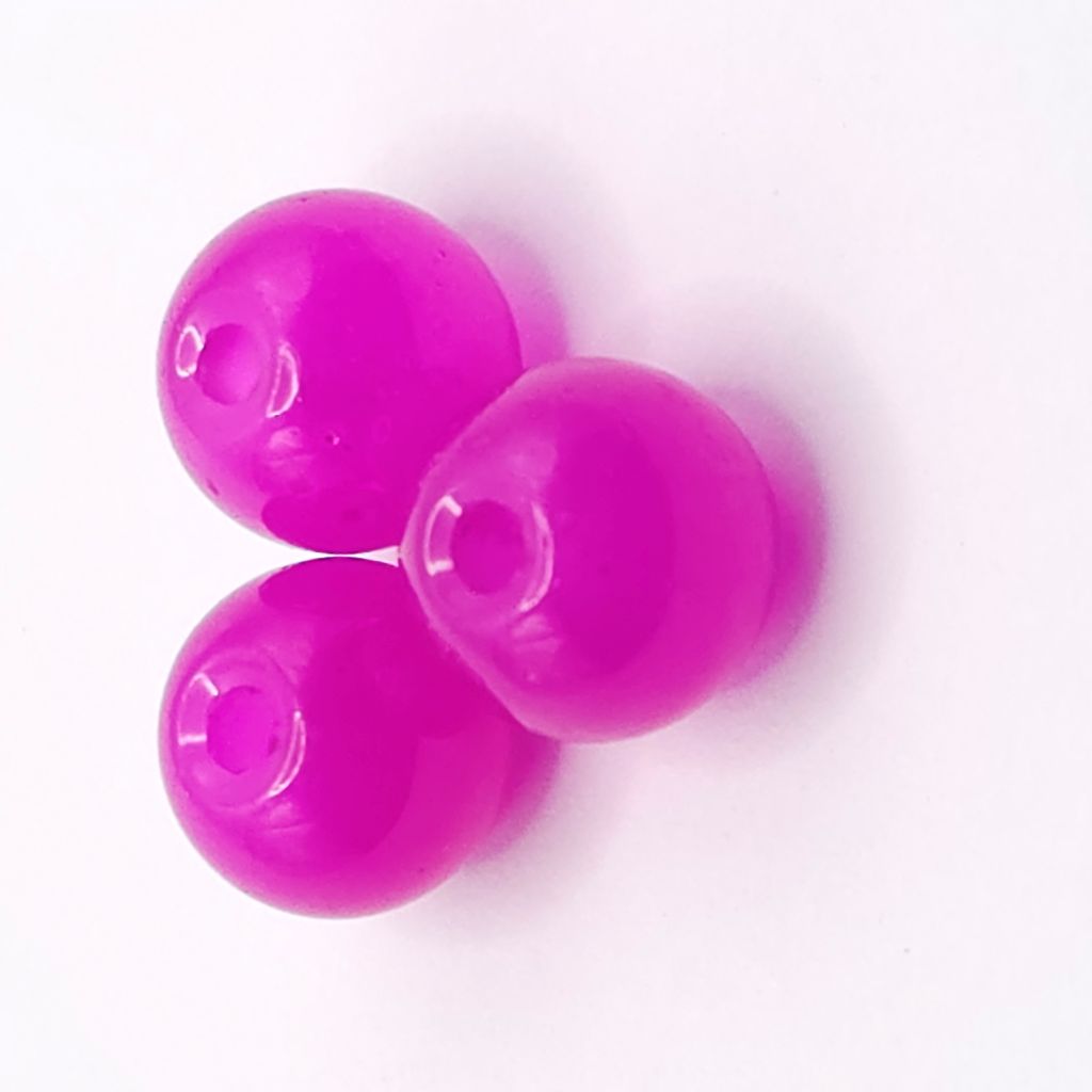 Three glossy purplish red beads with central holes, arranged on a plain white background.