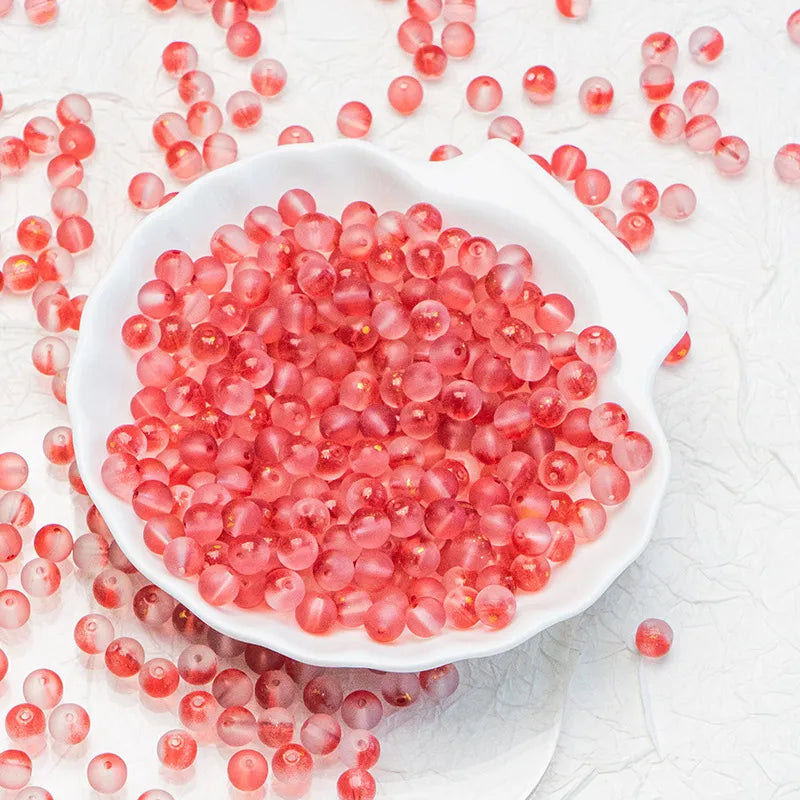 Red frosted glass beads with a matte finish. Bold, warm and perfect for standout handmade jewellery.